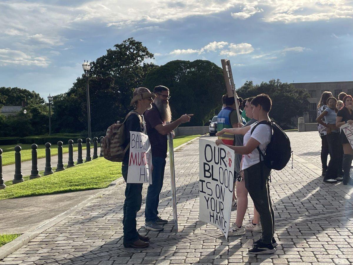 Anti-abortion protestors (left) argue with abortion-rights protestors at an abortion-rights protest at the Louisiana State Capitol on June 30,2022