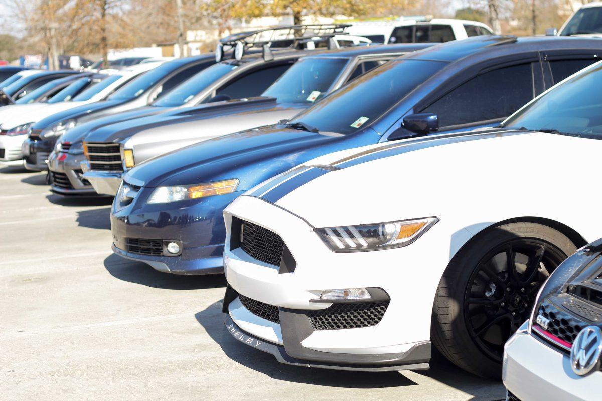 People line up their cars Jan. 30, 2022, in the parking lot for Street King BR's Caffeine and Octane car meet on Nicholson Drive in Baton Rouge, La.