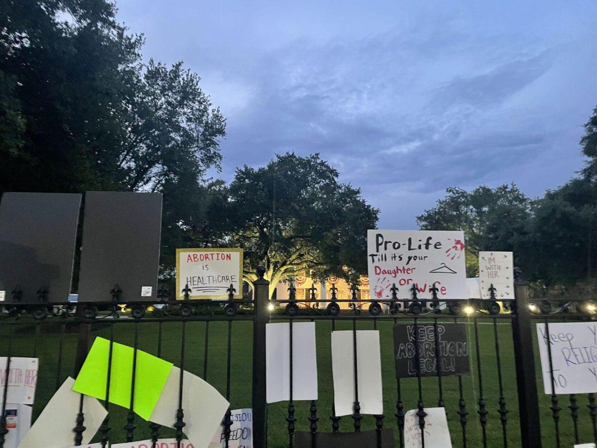 Abortion-rights protestors left their signs on the gate of the Louisiana governor's mansion on June 30, 2022