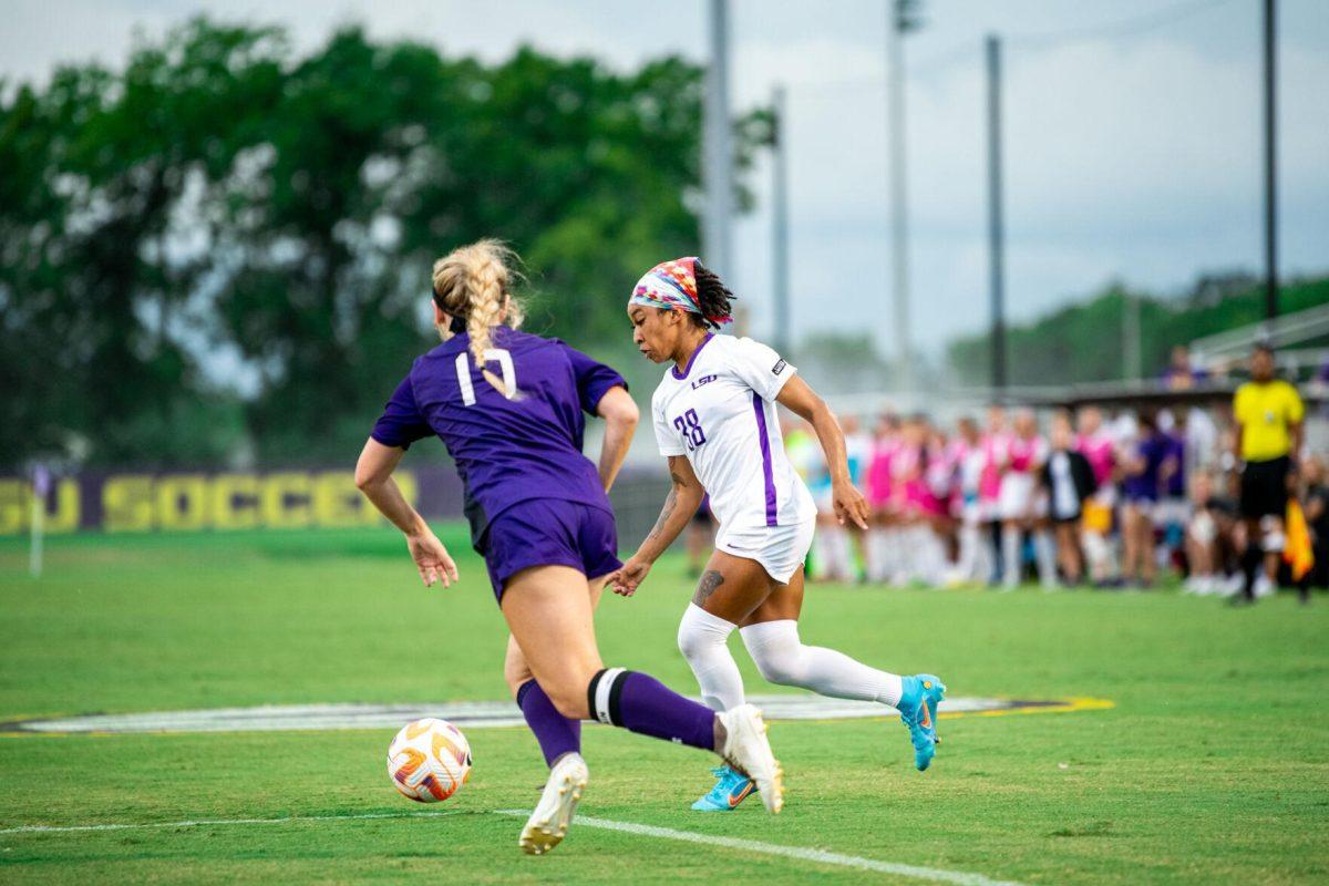 LSU soccer senior forward Rammie Noel (28) dribbles past a Stephen F. Austin defender Thursday, Aug. 18, 2022, during LSU’s 5-0 win against Stephen F. Austin at LSU's Soccer Stadium off of Nicholson Drive.