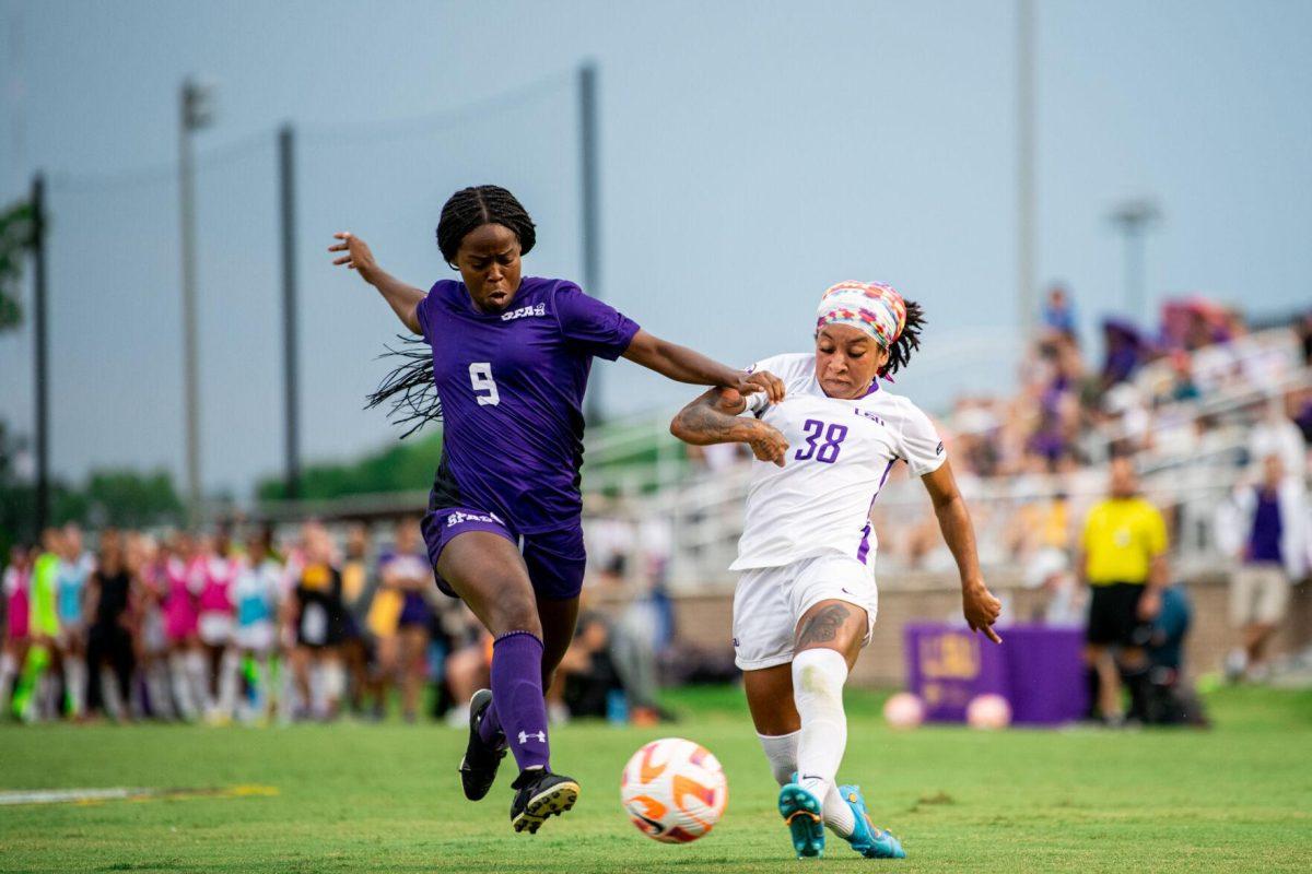 LSU soccer senior forward Rammie Noel (28) and Stephen F. Austin women’s soccer sophomore forward Kamryn Jiles (9) chase after the ball Thursday, Aug. 18, 2022, during LSU’s 5-0 win against Stephen F. Austin at LSU's Soccer Stadium off of Nicholson Drive.