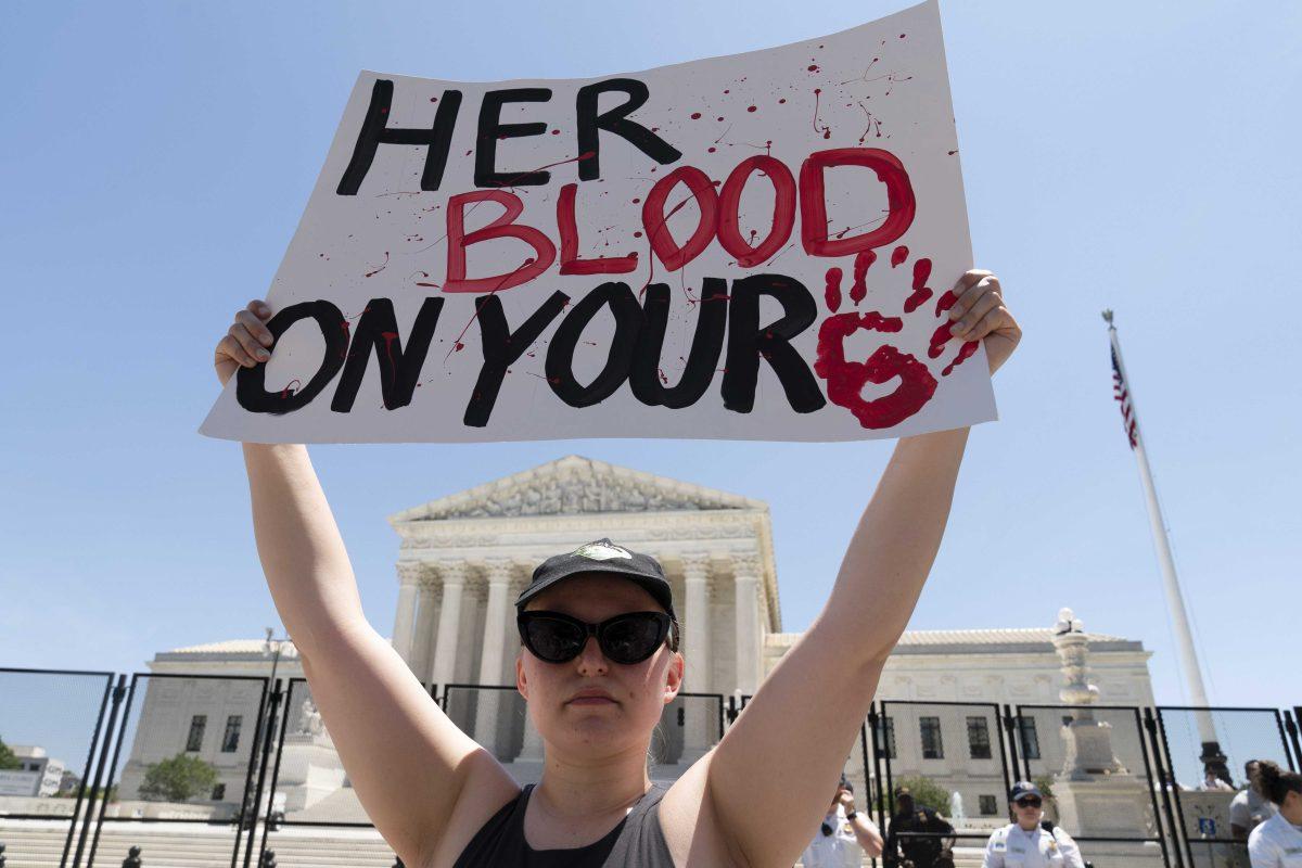 Abortion-rights activists protest outside the Supreme Court in Washington, Monday, July 4, 2022. The Supreme Court has ended constitutional protections for abortion that had been in place nearly 50 years, a decision by its conservative majority to overturn the court's landmark abortion cases. (AP Photo/Jose Luis Magana)