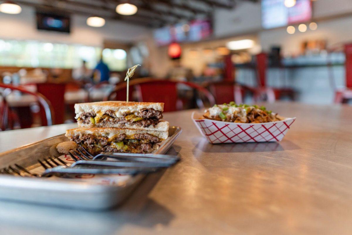 The special Hatch Chile dishes sit on a dining table on Monday, Aug. 29, 2022, at Curbside Burgers on Government Street in Baton Rouge, La.