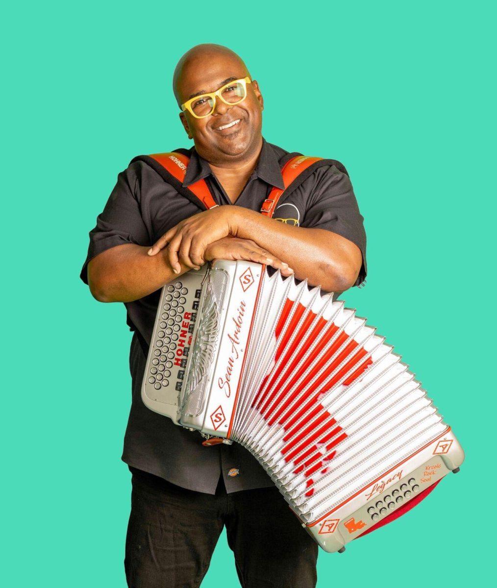 Sean Ardoin stands with his Louisiana-stamped accordion.