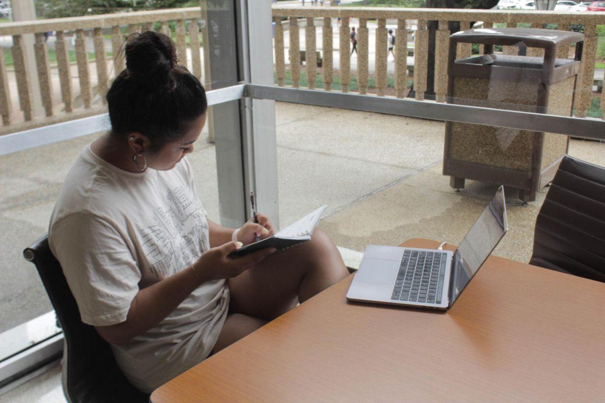 An LSU student writes notes while studying on Friday, Aug. 26, 2022, in the Student Union on LSU's Campus in Baton Rouge, La.