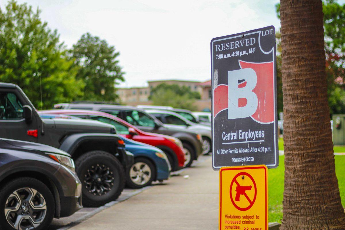 A sign designating parking spots for LSU central employees sits Thursday, Aug. 18, 2022, near the Pentagon on LSU's campus.