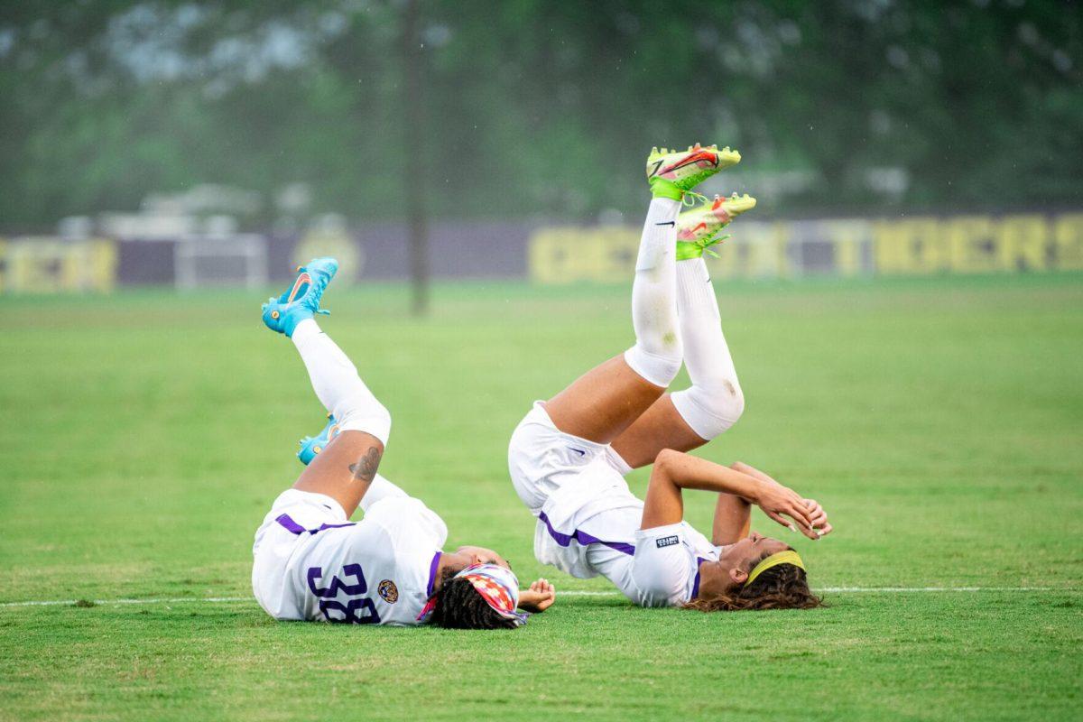 LSU soccer senior forward Rammie Noel (28) and redshirt junior forward Taylor Dobles (13) fall to the ground whilst celebrating a goal Thursday, Aug. 18, 2022, during LSU’s 5-0 win against Stephen F. Austin at LSU's Soccer Stadium off of Nicholson Drive.