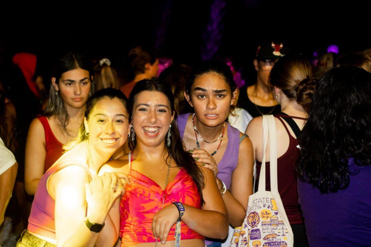 A group of LSU students pose for a photo Wednesday, Aug. 17, 2022, during the LSU Welcome Week Foam Party on Tower Drive in Baton Rouge, La.