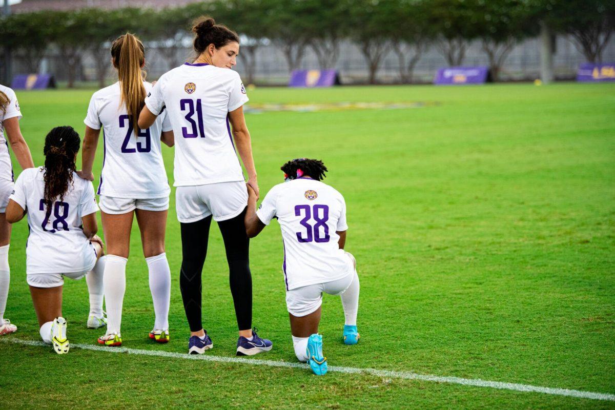 LSU soccer senior forward Rammie Noel (28) kneels down Thursday, Aug. 18, 2022, before LSU's 5-0 win against Stephen F. Austin at LSU's Soccer Stadium off of Nicholson Drive.