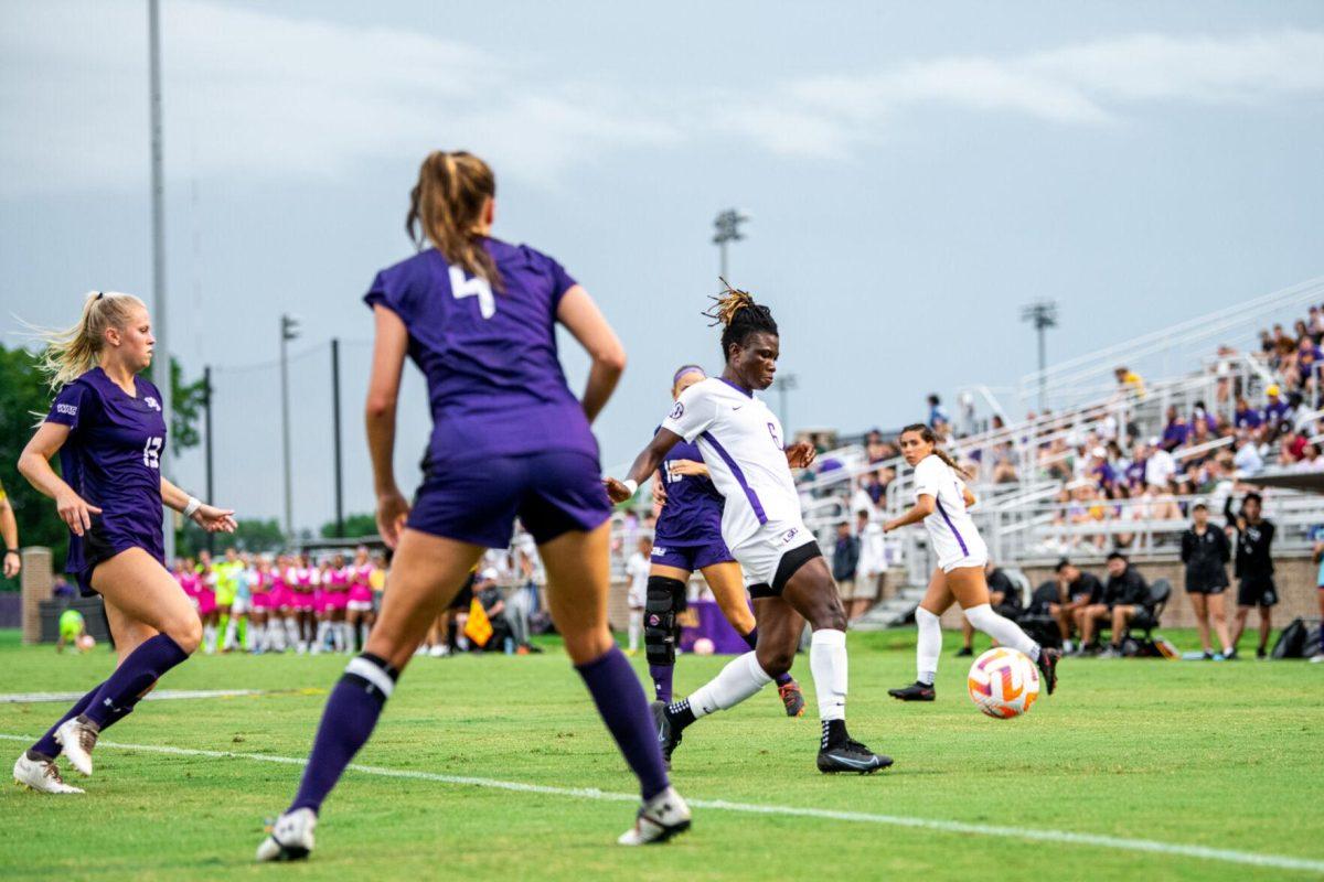 LSU soccer graduate student midfielder Wasila Diwura-Soale (6) weaves through defenders Thursday, Aug. 18, 2022, during LSU’s 5-0 win against Stephen F. Austin at LSU's Soccer Stadium off of Nicholson Drive.
