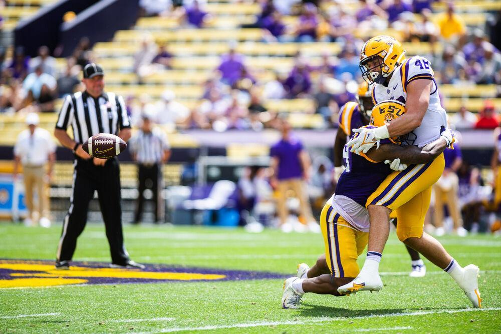 LSU football junior linebacker Mike Jones Jr (19) makes a tackle Saturday, April 23, 2022, during LSU football&#8217;s annual spring football game with White winning&#160;51-31 over Purple in Tiger Stadium.