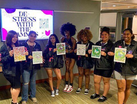 Sigma Lambda Gamma hosting a "De-stress with the Gammas" event.