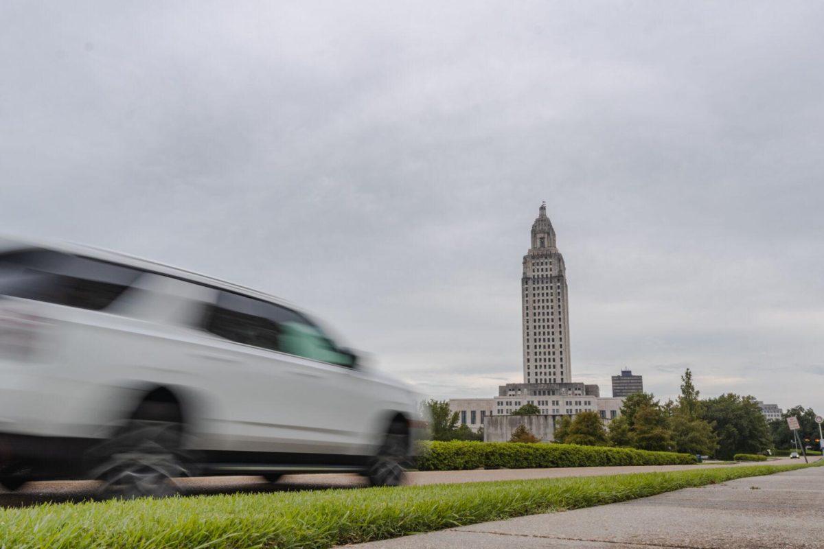 A car speeds down the road on Monday, Aug. 22, 2022, by the State Capitol on North 3rd Street in Baton Rouge, La.