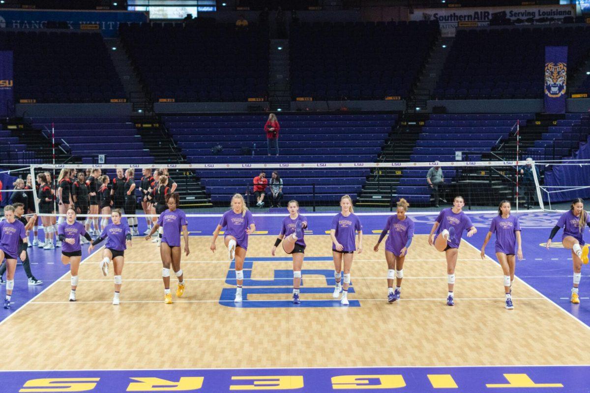 The LSU volleyball team warms up on Friday, Aug. 26, 2022, prior to their 3-1 loss against Houston in the Pete Maravich Assembly Center in Baton Rouge, La.