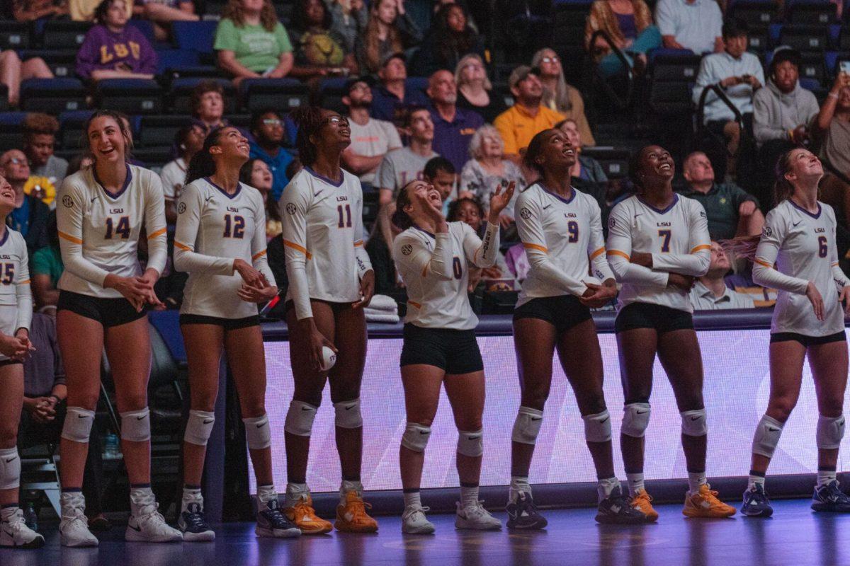 The LSU volleyball team enjoys the pre-match display on the jumbotron on Friday, Aug. 26, 2022, prior to their 3-1 loss against Houston in the Pete Maravich Assembly Center in Baton Rouge, La.