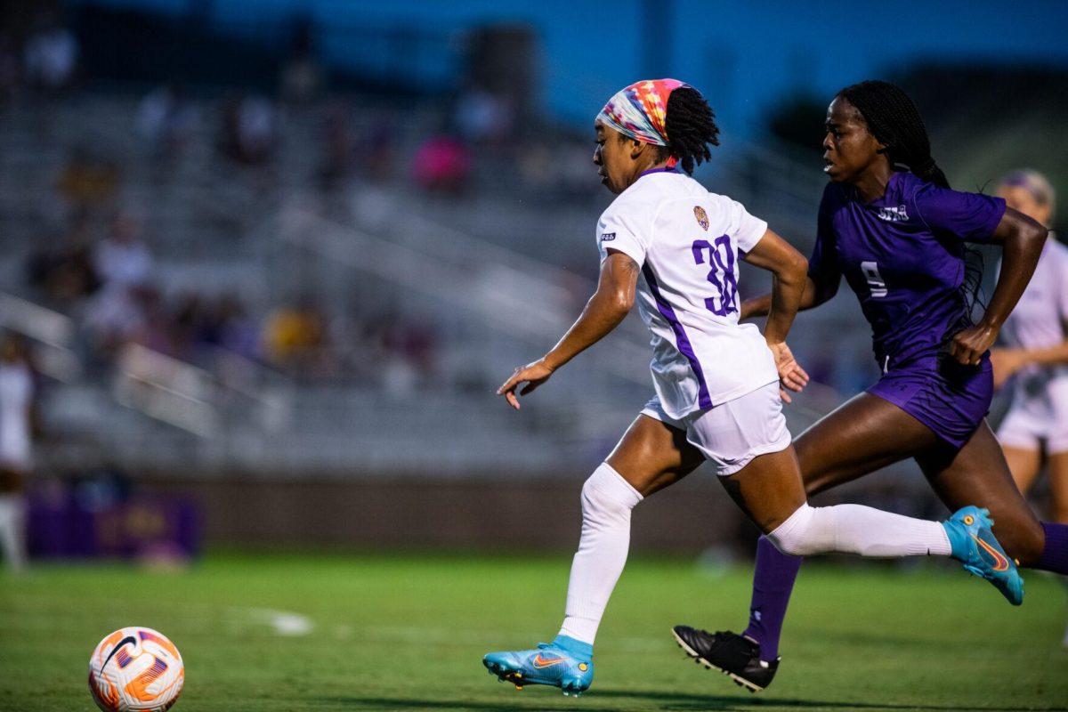 LSU soccer senior forward Rammie Noel (28) and Stephen F. Austin women’s soccer sophomore forward Kamryn Jiles (9) run after the ball Thursday, Aug. 18, 2022, during LSU’s 5-0 win against Stephen F. Austin at LSU's Soccer Stadium off of Nicholson Drive.