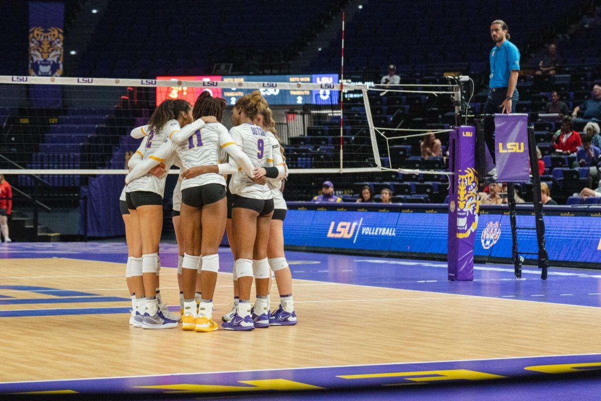 The LSU volleyball team huddles up on Friday, Aug. 26, 2022, prior to their 3-1 loss against Houston in the Pete Maravich Assembly Center in Baton Rouge, La.