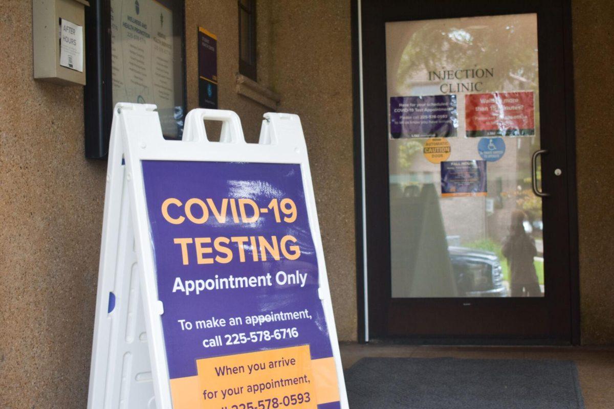 A Covid-19 testing sign sits Friday, August 19, 2022, in front of the doors of the LSU Student Health Center on Infirmary Road, Baton Rouge, La.