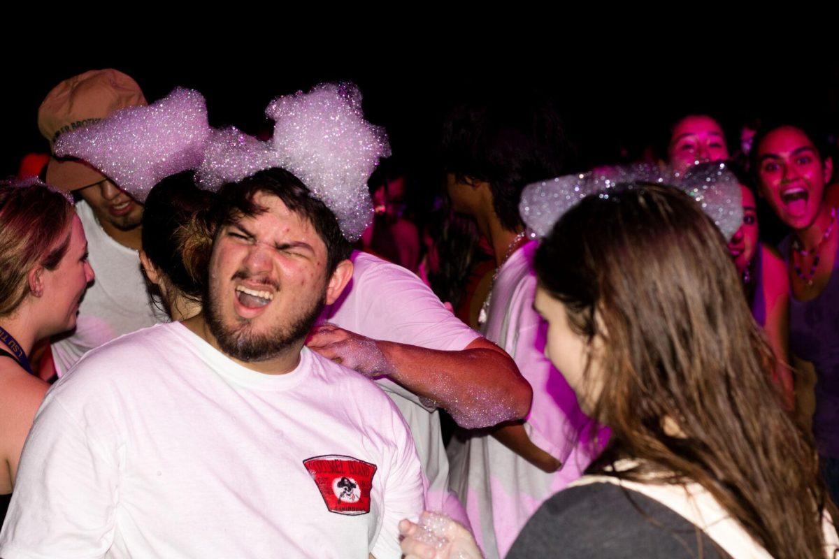 A LSU student makes a face Wednesday, Aug. 17, 2022, during the LSU Welcome Week Foam Party on Tower Drive in Baton Rouge, La.