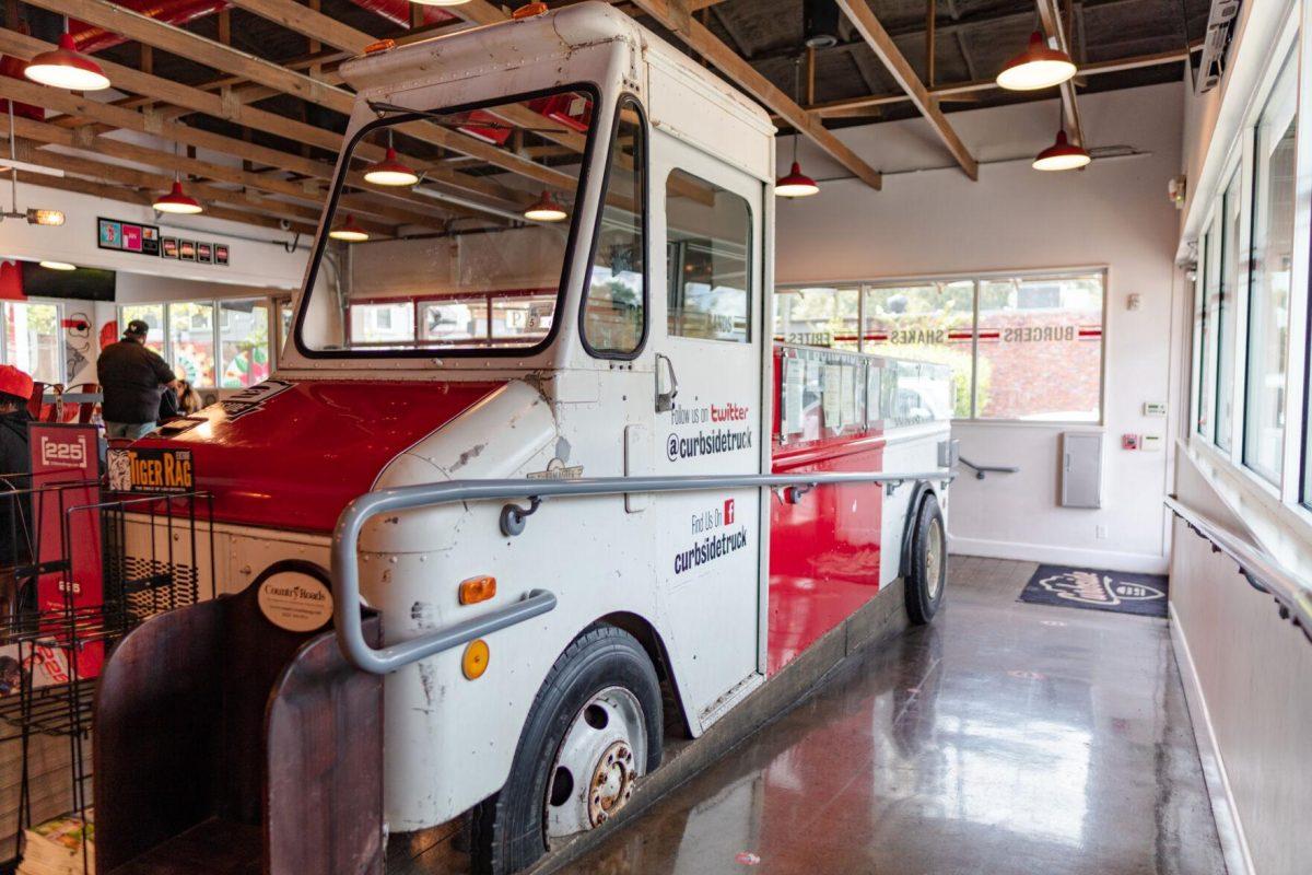 A portion of the old food truck sits within the restaurant on Monday, Aug. 29, 2022, at Curbside Burgers on Government Street in Baton Rouge, La.