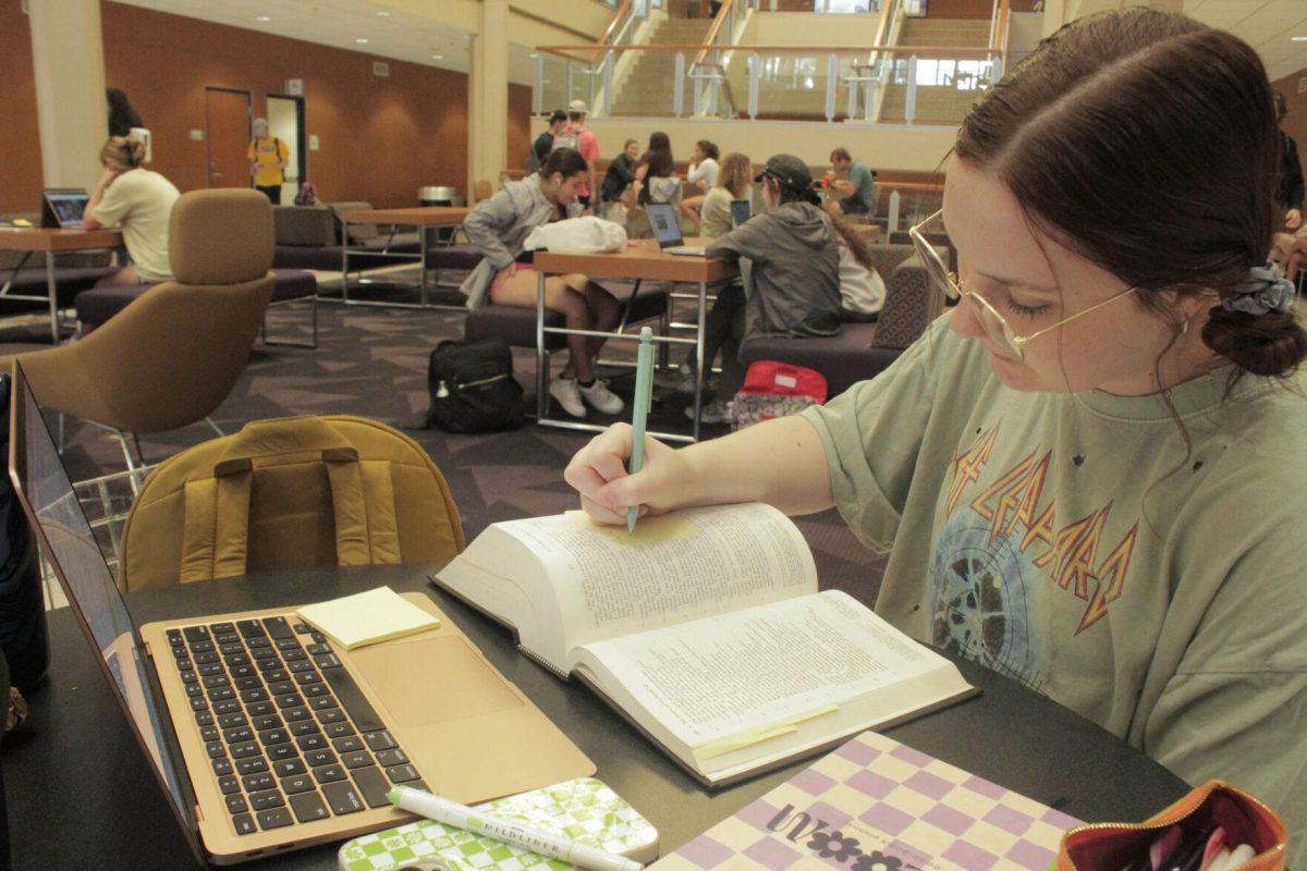 An LSU student reads and writes in her book while studying on Friday, Aug. 26, 2022, in the Student Union on LSU's Campus in Baton Rouge, La.