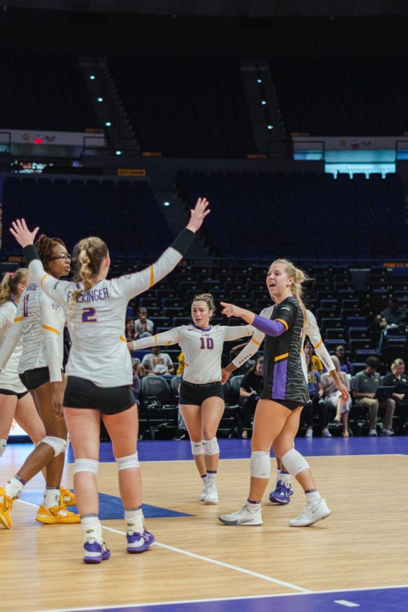 The LSU volleyball team celebrates another point on Friday, Aug. 26, 2022, during their 3-1 loss against Houston in the Pete Maravich Assembly Center in Baton Rouge, La.