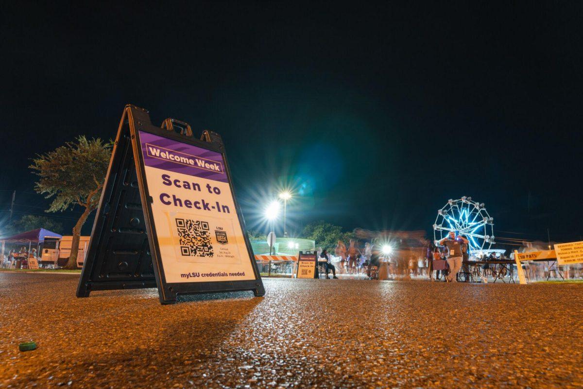 A sign displays a QR code on Saturday, Aug. 20, 2022, at the Welcome Week Carnival near Tiger Stadium on South Stadium Drive in Baton Rouge, La.