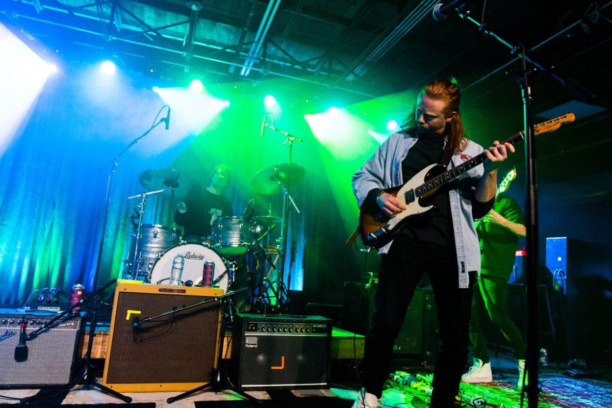 Jake Heflin plays the guitar as Baton Rouge band Wumbo performs.&#160;