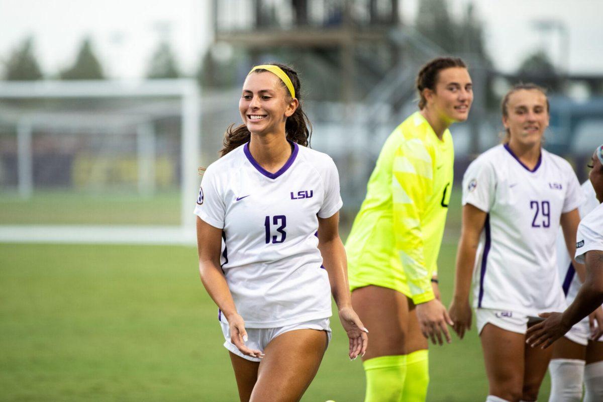 LSU soccer redshirt junior forward Taylor Dobles (13) smiles as she walks onto the pitch Thursday, Aug. 18, 2022, before LSU's 5-0 win against Stephen F. Austin at LSU's Soccer Stadium off of Nicholson Drive.