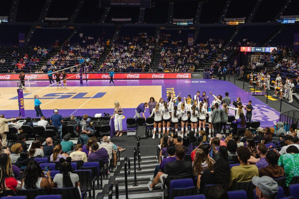 The LSU volleyball team put their hands up for a cheer after a time out on Friday, Aug. 26, 2022, during their 3-1 loss against Houston in the Pete Maravich Assembly Center in Baton Rouge, La.