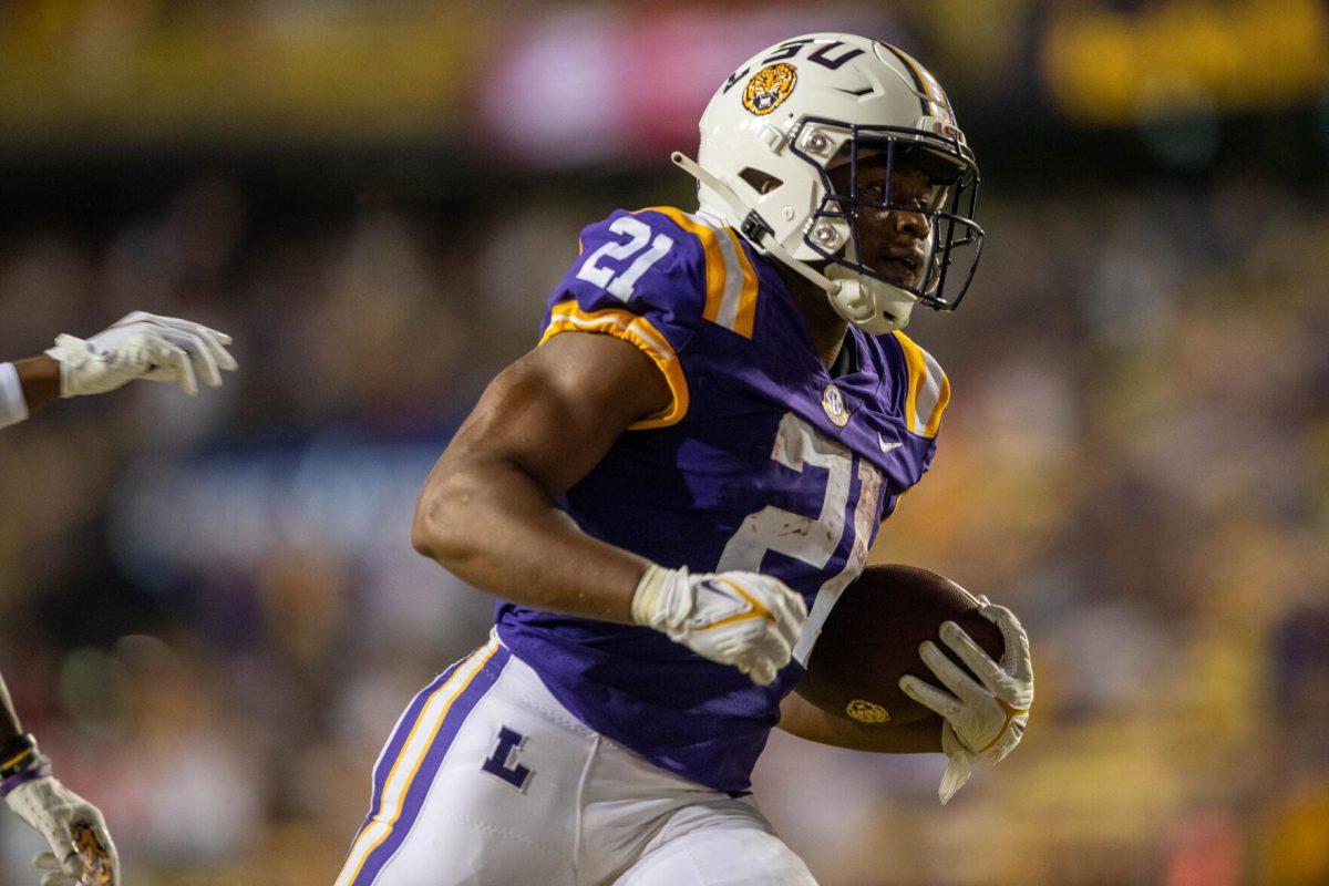 LSU football junior running back Noah Cain (21) runs with the ball on Saturday, Sept. 24, 2022, during the LSU vs New Mexico game in Tiger Stadium.