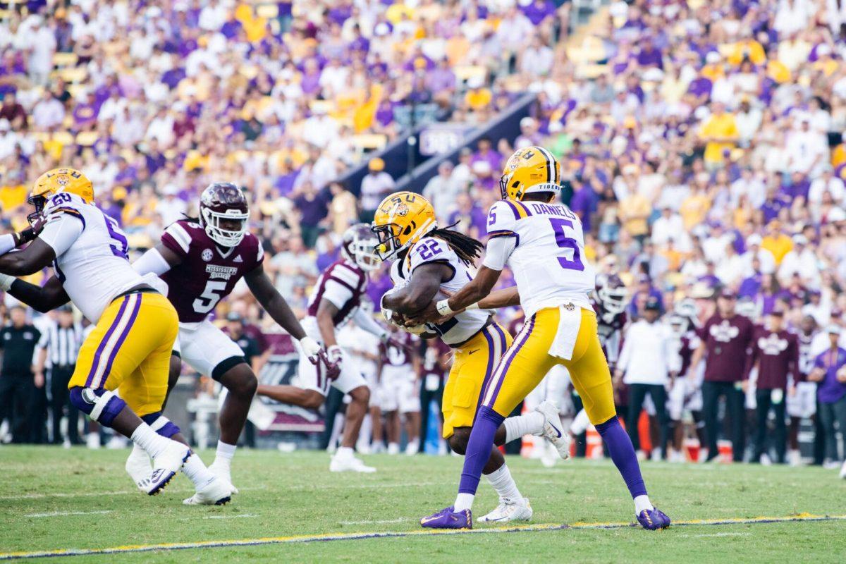 LSU football junior quarterback Jayden Daniels (5) hands the ball off to sophomore running back Armoni Goodwin (22) Saturday, Sept. 17, 2022 during LSU’s 31-16 win against Mississippi State at Tiger Stadium in Baton Rouge, La.