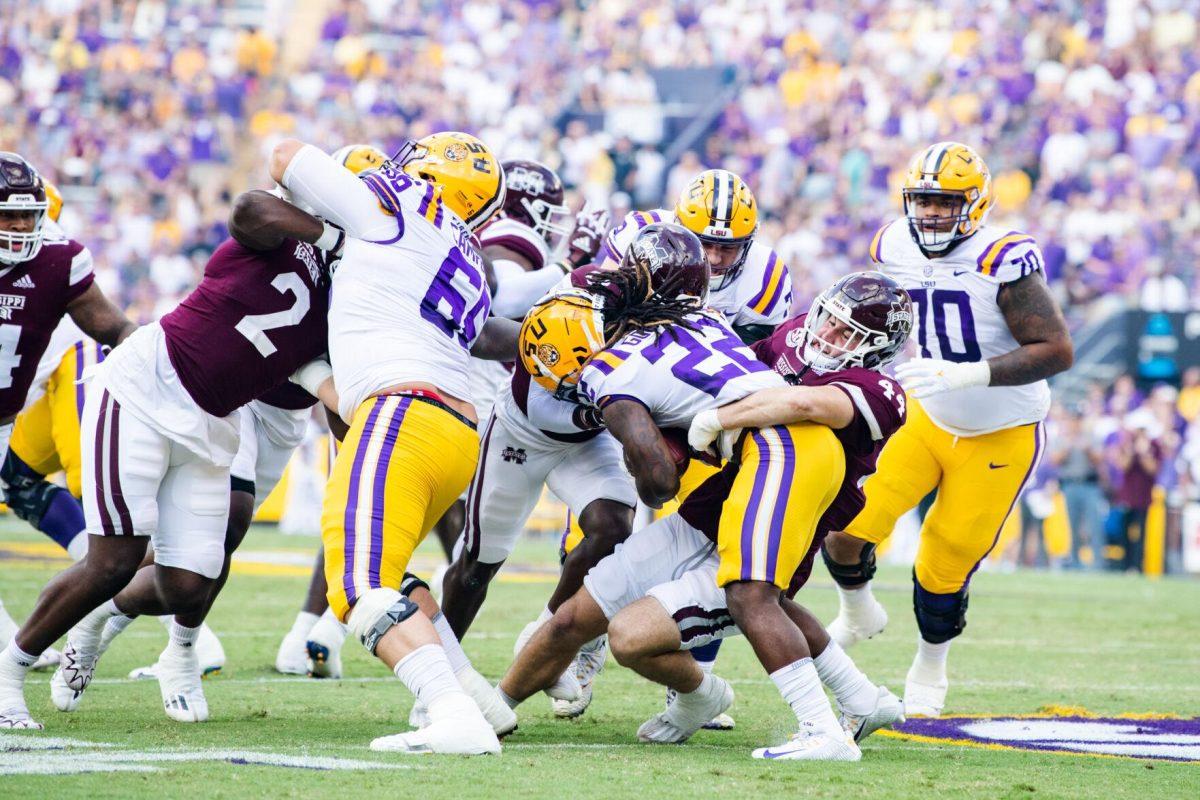 LSU football sophomore running back Armoni Goodwin (22) fights through the Mississippi State defensive line Saturday, Sept. 17, 2022 during LSU’s 31-16 win against Mississippi State at Tiger Stadium in Baton Rouge, La.