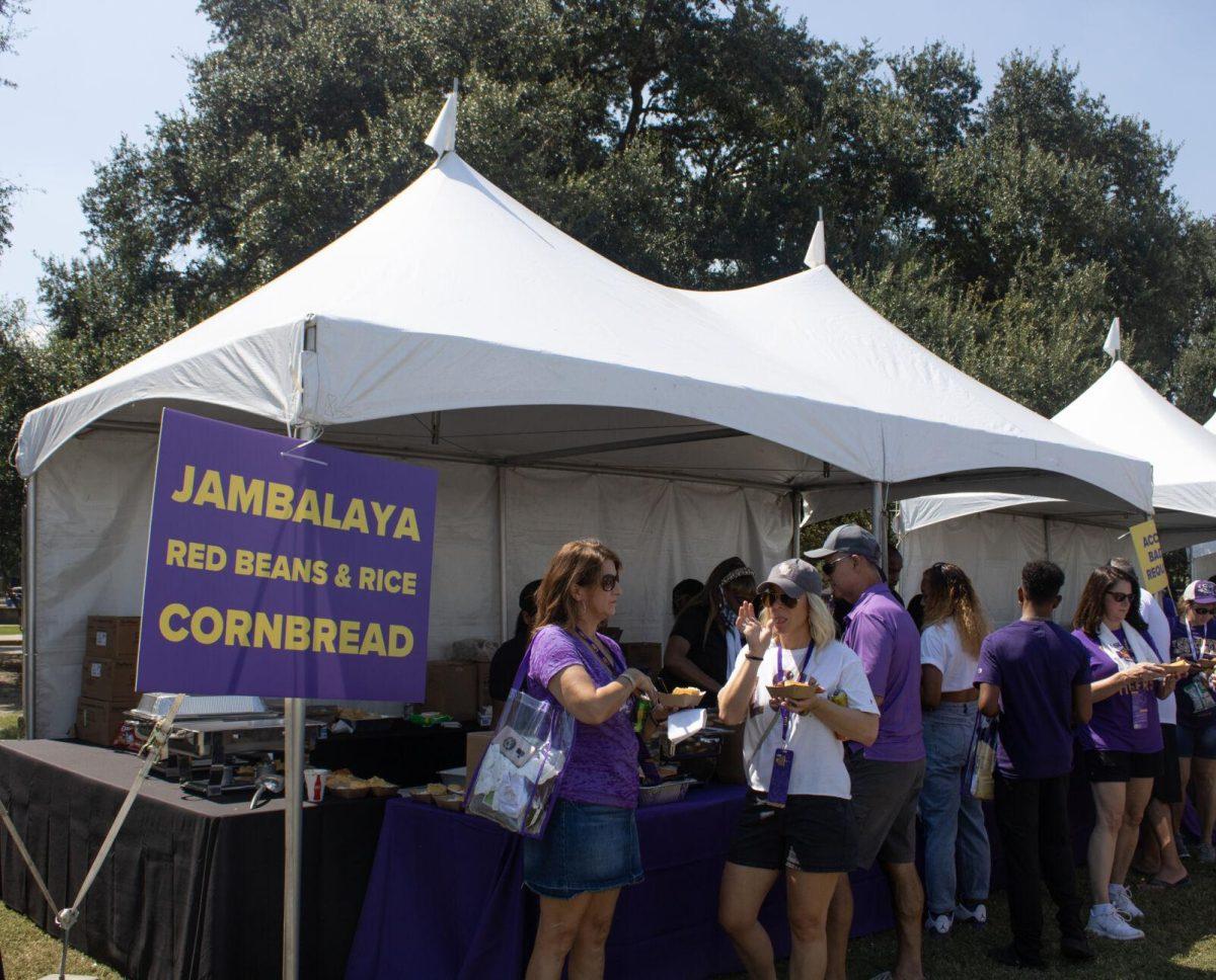 Family members receive food at the LSU Family Weekend Tailgate on Saturday, Sept. 24, 2022, on the LSU Parade Ground in Baton Rouge, La.