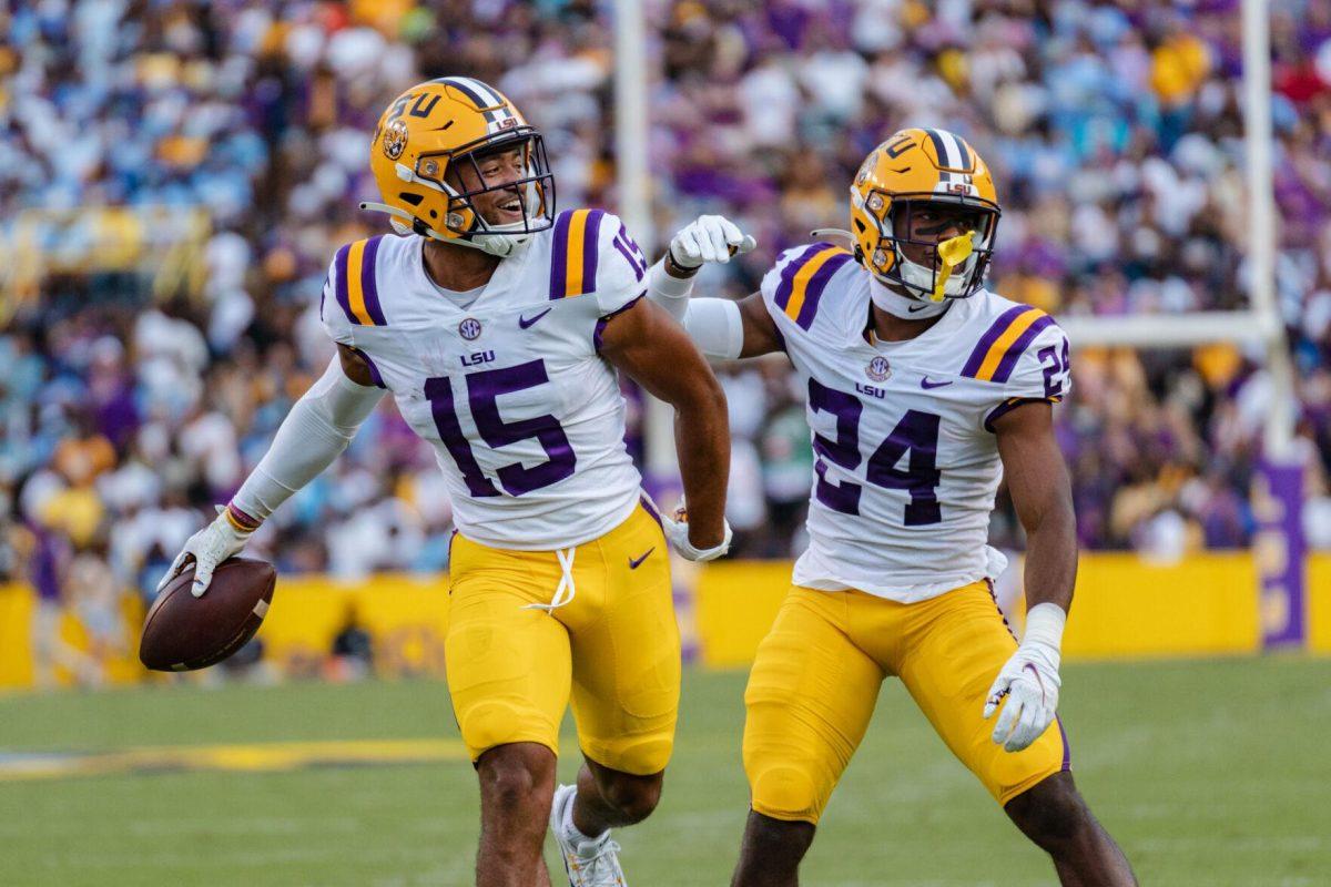 LSU football redshirt freshman safety Sage Ryan (15) and senior cornerback Jarrick Bernard-Converse (24) celebrate the fumble recovery on Saturday, Sept. 10, 2022, during LSU&#8217;s 65-17 win over Southern at Tiger Stadium in Baton Rouge, La.