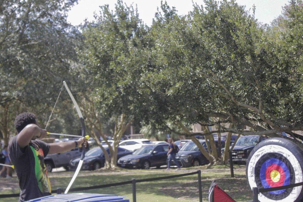 A student practices archery during Fall Fest on Friday, Sept. 16, 2022, on the LSU Parade Ground.