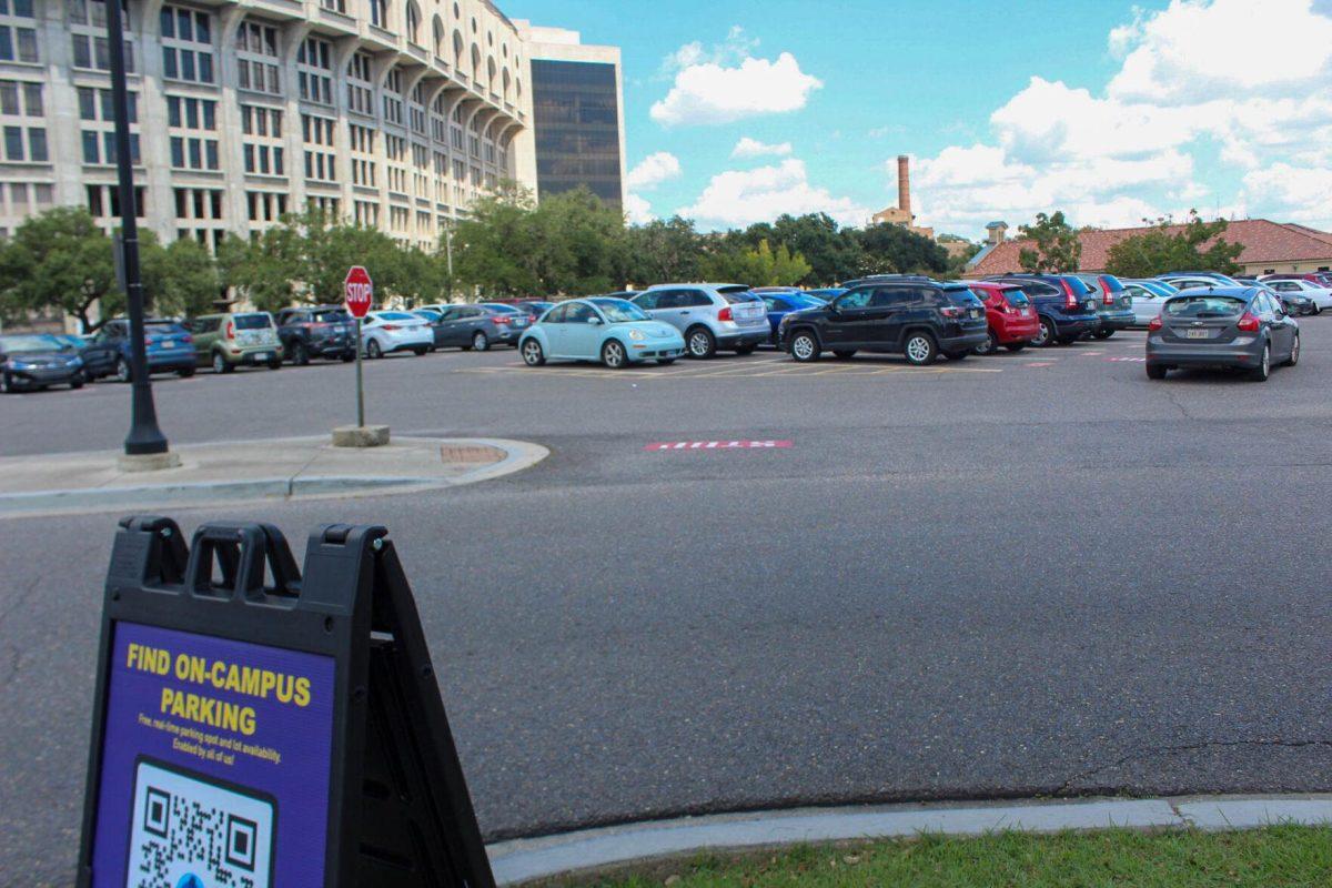 A QR code for finding more parking in commuter lots sits in the South Stadium commuter lot while student looks for parking on Friday, Aug. 2nd, 2022, in Baton Rouge, La.