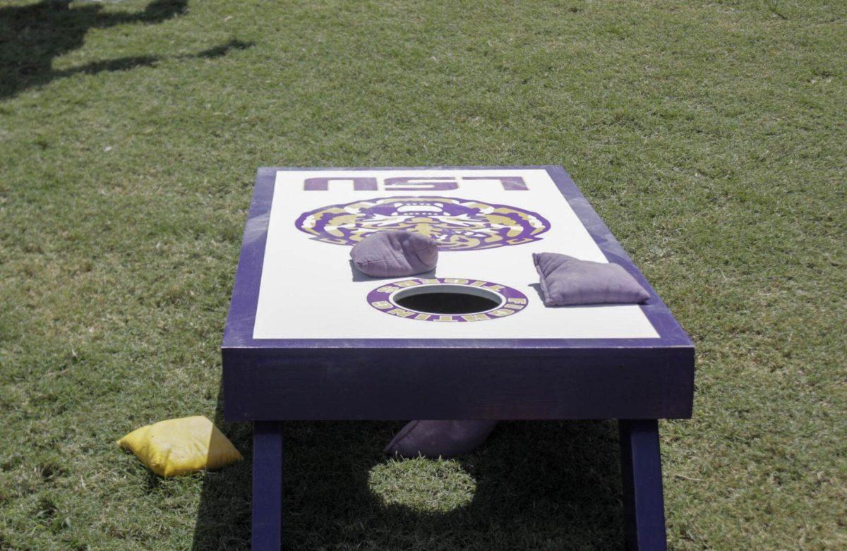 Students play cornhole at Fall Fest on Friday, Sept. 16, 2022, on the LSU Parades Ground.