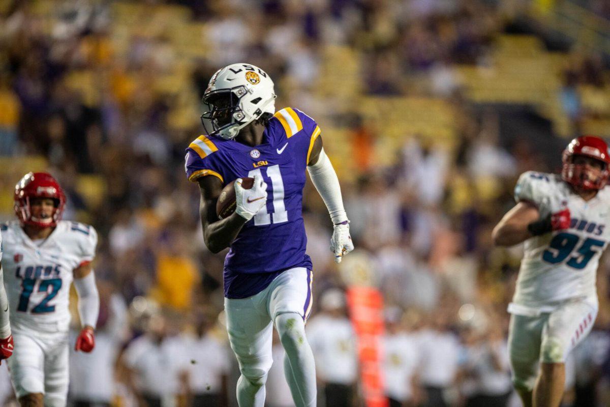 LSU football sophomore wide receiver Brian Thomas Jr. (11) runs the ball and makes a touchdown on Saturday, Sept. 24, 2022, during the LSU vs New Mexico game in Tiger Stadium&#160;in Baton Rouge, La.