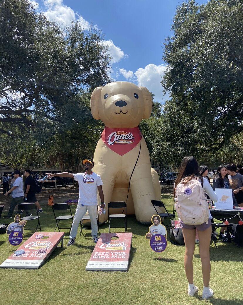 An inflatable dog stands behind the Raising Cane's booth at Fall Fest on Friday, Sep. 16.