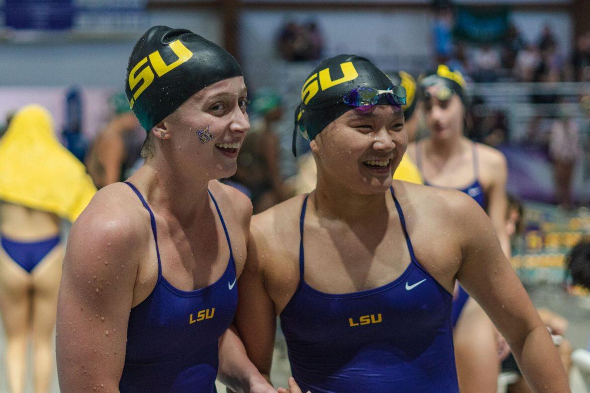 LSU swim sprint freestyle Peyton Curry (left) and freestyle freshman Chloe Cheng (right) congratulate each other after a race on Friday, Sept. 23, 2022, during LSU&#8217;s victory over Tulane and Vanderbilt at the LSU Natatorium on Nicholson Drive in Baton Rouge, La.