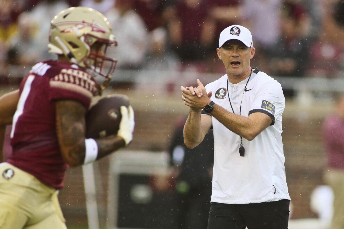 Florida State head coach Mike Norvell encourages his players before the start of an NCAA college football game against Duquesne, Saturday, Aug. 27, 2022, in Tallahassee, Fla. (AP Photo/Phil Sears)