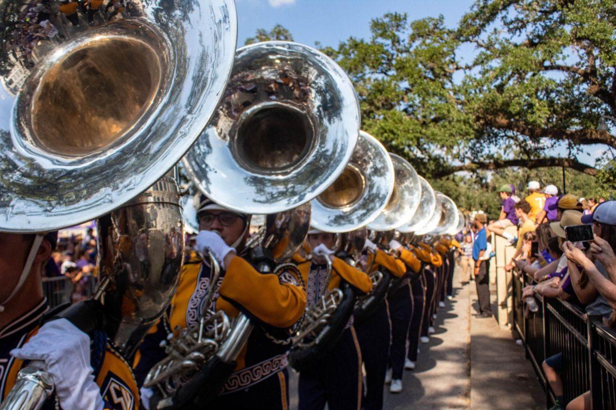 A line of tubas march down Victory Hill on Saturday, Sept. 24, 2022, on North Stadium Drive.