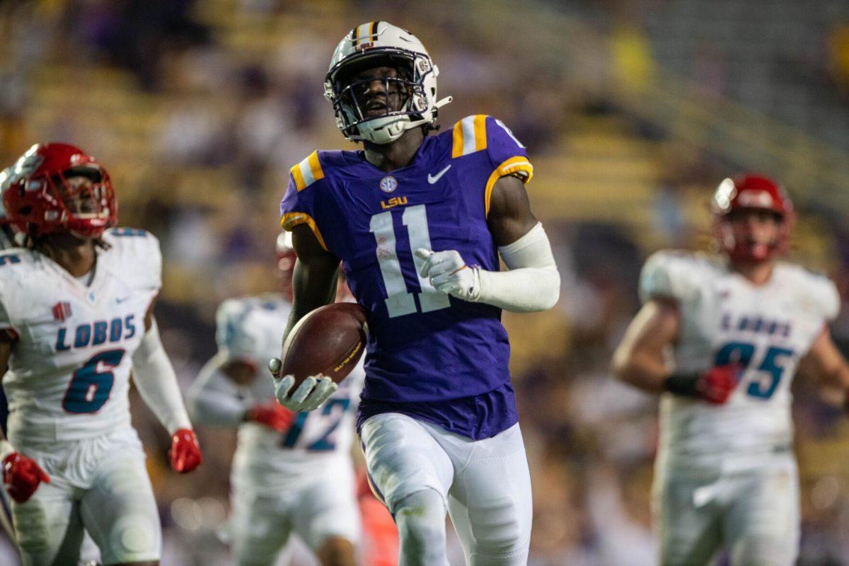 LSU football sophomore wide receiver Brian Thomas Jr. (11) runs the ball and makes a touchdown on Saturday, Sept. 24, 2022, during the LSU vs New Mexico game in Tiger Stadium&#160;in Baton Rouge, La.