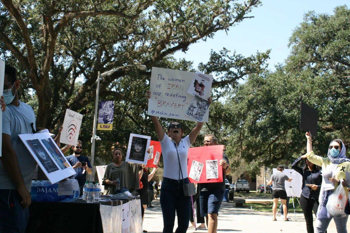 "Woman, life, freedom," is called by advocates for the situation in Iran in Free Speech Alley on Sept. 23, 2022.