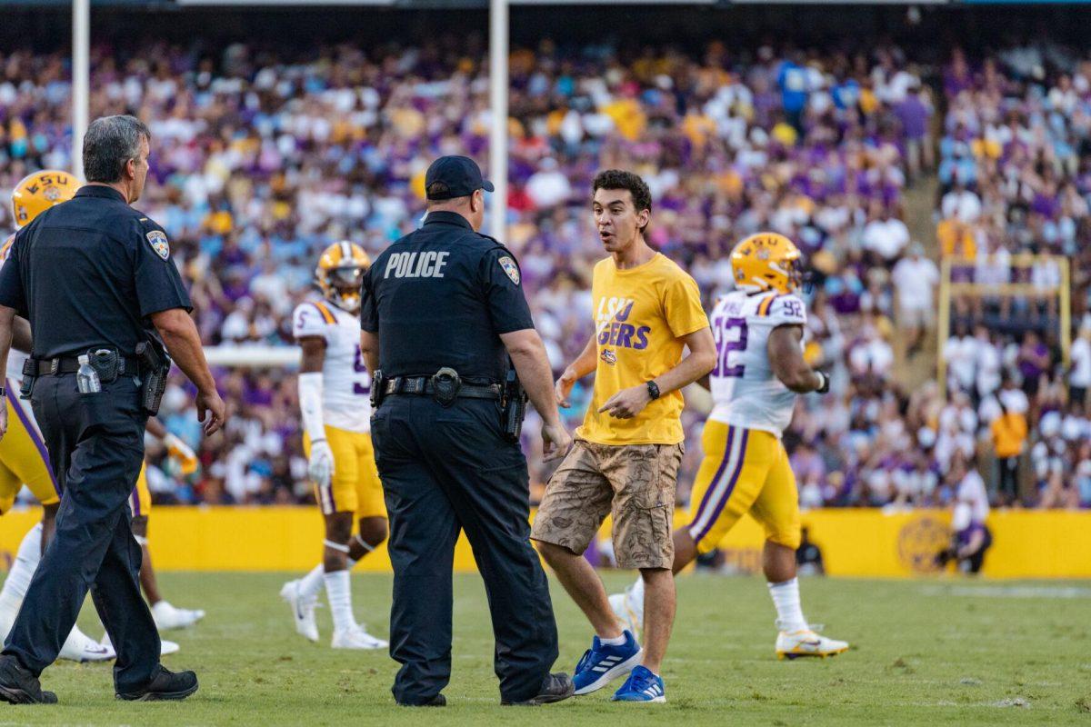 The police confront the random person on the field on Saturday, Sept. 10, 2022, during LSU&#8217;s 65-17 win over Southern at Tiger Stadium in Baton Rouge, La.