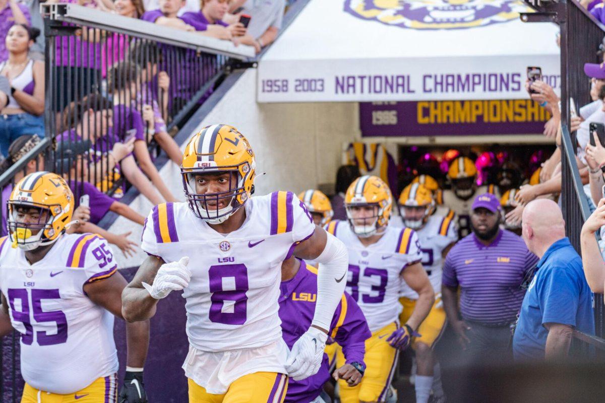 LSU football junior linebacker Desmond Little (8) runs onto the field on Saturday, Sept. 10, 2022, before LSU&#8217;s 65-17 win over Southern at Tiger Stadium in Baton Rouge, La.