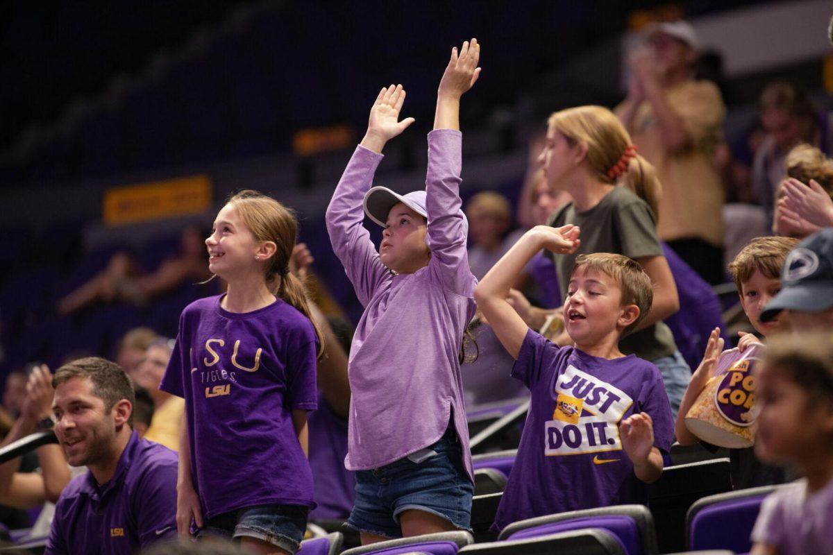 LSU volleyball fans celebrate their win on Friday, Sept. 2, 2022, after LSU&#8217;s 3-0 victory over Iowa State in the Pete Maravich Assembly Center in Baton Rouge, La.