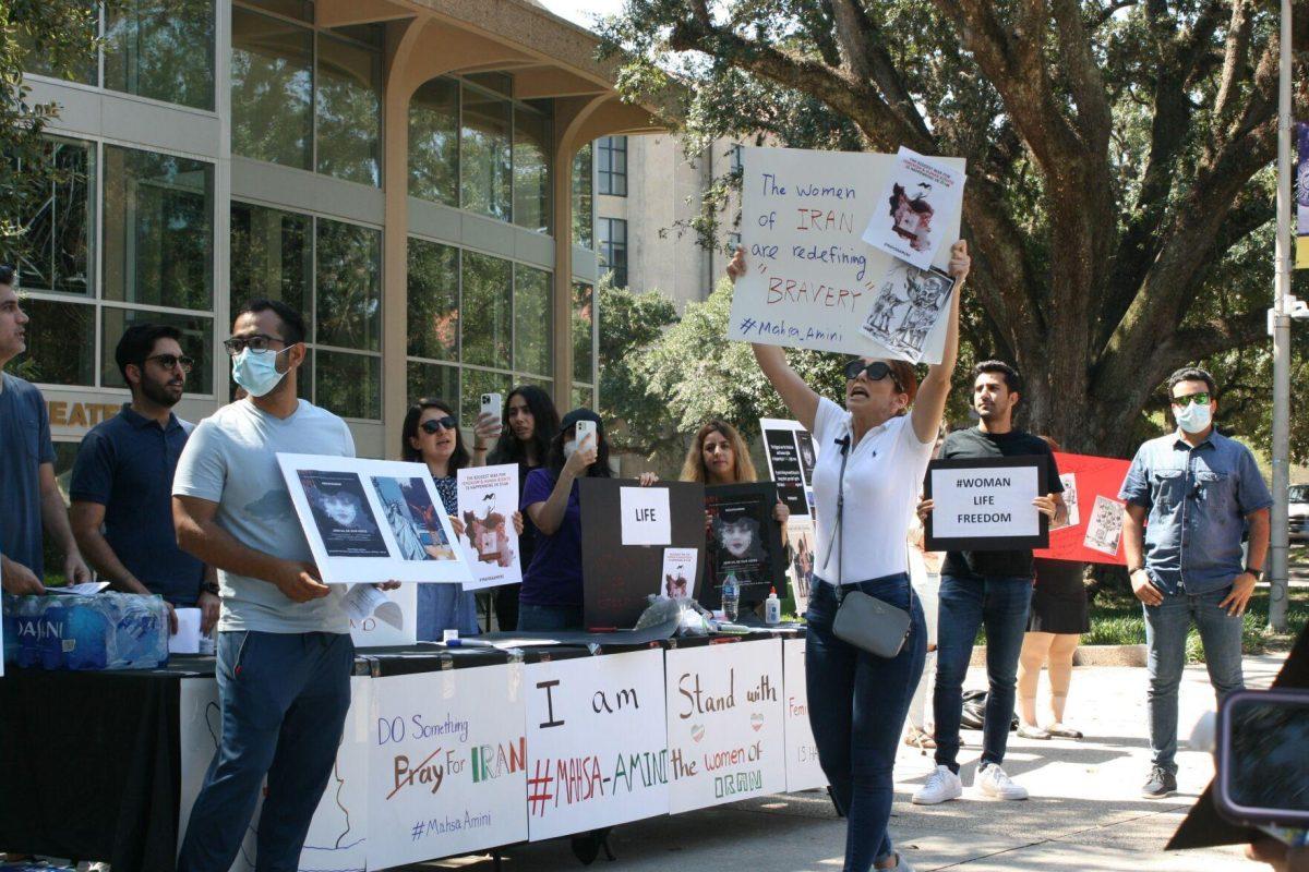 "Woman, life, freedom," is called by advocates for the situation in Iran in Free Speech Alley on Sept. 23, 2022.