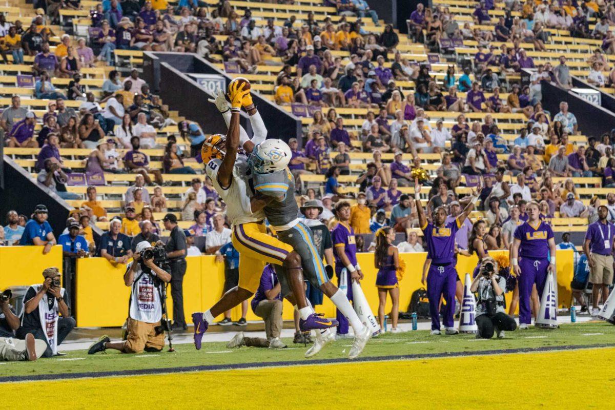 LSU football junior wide receiver Kyren Lacy (2) jumps up for the ball on Saturday, Sept. 10, 2022, during LSU&#8217;s 65-17 win over Southern at Tiger Stadium in Baton Rouge, La.